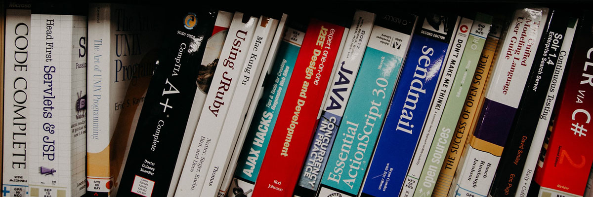 computer science textbooks on a library shelf